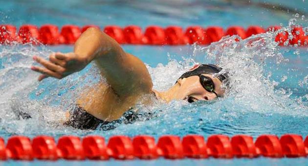 In this June 27, 2017, file photo, Katie Ledecky swims on her way to winning the women's 800-meter freestyle at the U.S. swimming championships in Indianapolis. Ledecky is turning pro. The five-time Olympic gold medalist announced on Twitter that she is giving up her final two years of eligibility at Stanford, though she will continue to train at the West Coast school as she works toward her degree. (AP Photo/Michael Conroy, File)