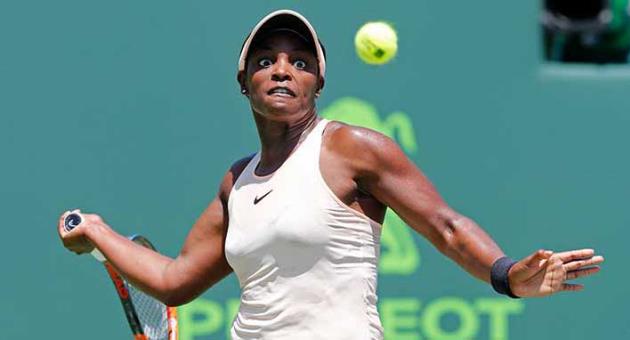 Sloane Stephens returns the ball to Victoria Azarenka, of Belarus, during their semifinal match in the Miami Open tennis tournament, Thursday, March 29, 2018, in Key Biscayne, Fla. (AP Photo/Joe Skipper)