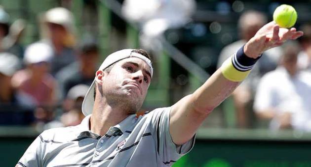 John Isner serves to Juan Martin del Potro, of Argentina, during a semifinal match at the Miami Open tennis tournament, Friday, March 30, 2018, in Key Biscayne, Fla. Isner won 6-1, 7-6 (2). (AP Photo/Lynne Sladky)