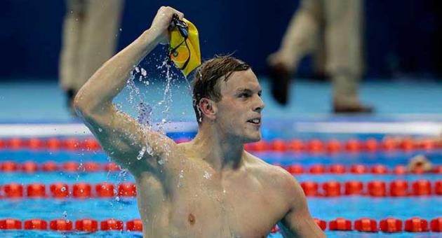 In this Aug. 10, 2016, file photo, Australia's Kyle Chalmers celebrates winning the gold in the men's 100-meter freestyle during the swimming competitions at the 2016 Summer Olympics in Rio de Janeiro, Brazil. More than 6,600 athletes and officials from across the world will converge on the Gold Coast for the 21st edition of the Commonwealth Games, the quadrennial multi-sports event for 71 countries and territories of the British Commonwealth. (AP Photo/David J. Phillip,File)