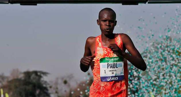 Kenya's Paul Lonyangata celebrates as he crosses the finish line to win the 42nd Paris Marathon men's race, in Paris, Sunday, April 8, 2018. (AP Photo/Thibault Camus)