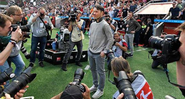 Frankfurt's head coach Niko Kovac is surrounded by cameras prior the German Bundesliga soccer match between Bayer Leverkusen and Eintracht Frankfurt in Leverkusen, Germany, Saturday, April 14, 2018. Kovac was announced as new Bayern head coach for next season. (AP Photo/Martin Meissner)
