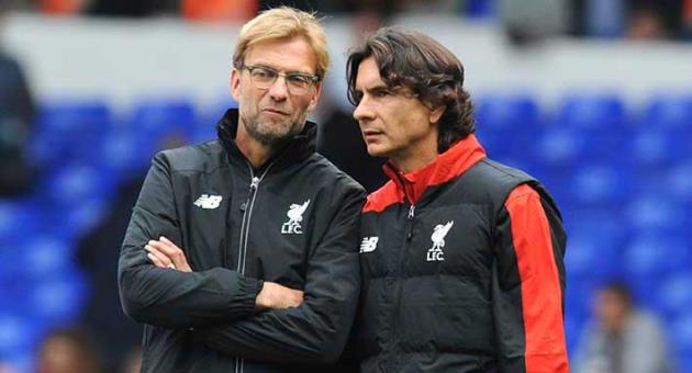 In this file photo dated Saturday, Oct. 17, 2015, Liverpool manager Juergen Klopp, left, talks with assistant manager Zeljko Buvac before their English Premier League soccer match against Tottenham Hotspur at the White Hart Lane in London. Liverpool’s assistant coach Buvac, is spending some time away from the team until the end of the season for personal reasons, it is announced Monday April 30, 2018, potentially disrupting the team’s bid to qualify for the Champions League final this week. (AP Photo/Rui Vieira, FILE)