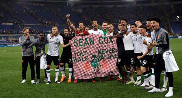 Liverpool players hold a banner in English and Italian in support of Liverpool fan Sean Cox at the end of the Champions League semifinal second leg soccer match between Roma and Liverpool at the Olympic Stadium in Rome, Wednesday, May 2, 2018. Cox has been in an induced coma since being attacked before the first leg match in Liverpool. (AP Photo/Alessandra Tarantino)