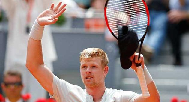 Kyle Edmund of Britain celebrates after beating Novak Djokovic of Serbia 6-3, 2-6, 6-3 during the Madrid Open Tennis tournament in Madrid, Spain, Wednesday, May 9, 2018. (AP Photo/Paul White)
