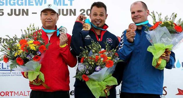 The three medallists (L - R) Du Yu from China who won Silver, Gold for Great Britain's Aaron Heading (C) and Bronze for Marian Kovacocy from Slovakia in the Trap Men Final event at the ISSF World Cup Shotgun in Malta, on June 13 2018. Photo: Domenic Aquilina