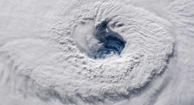 In this Sept. 12, 2018 photo provided by NASA, Hurricane Florence churns over the Atlantic Ocean heading for the U.S. east coast as seen from the International Space Station. Astronaut Alexander Gerst, who shot the photo, tweeted: 