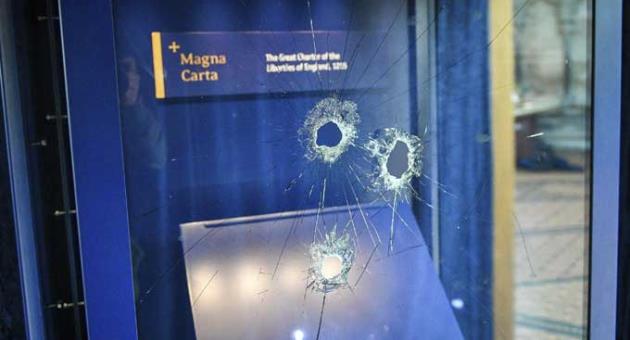Hammer holes in the glass case that housed the Magna Carta, at Salisbury Cathedral after a 45-year-old man has been arrested on suspicion of its attempted theft, in Salisbury, England, Friday Oct. 26, 2018.
