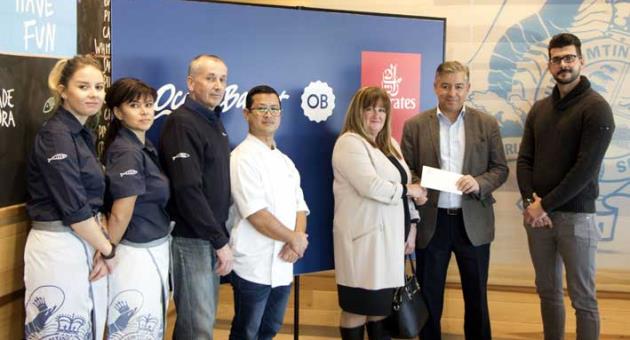 Carmen Borg (fifth from left) receiving her prize in the presence of (from left) Zhaneta Katrishka (Ocean Basket Front of House Manager), Iskra Stefanova (Ocean Basket Kitchen Manager), Jon Smith (Ocean Basket Operations Manager), Maheshwor Shrestha (Ocean Basket Sushi Chef), Paul Fleri Soler (Emirates Manager Malta) and Daniel Borg.