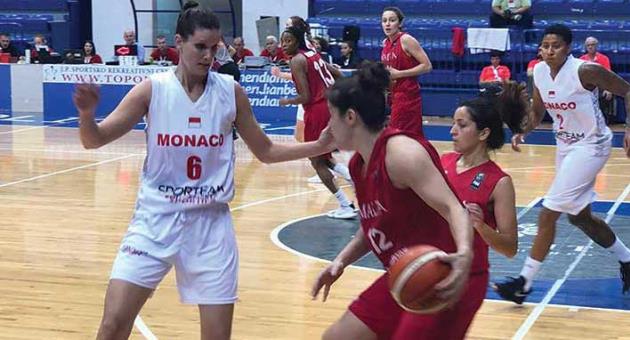 Malta’s Patricia Arguello (no 12 in red) in action yesterday.  Photo: Chris Cassar
