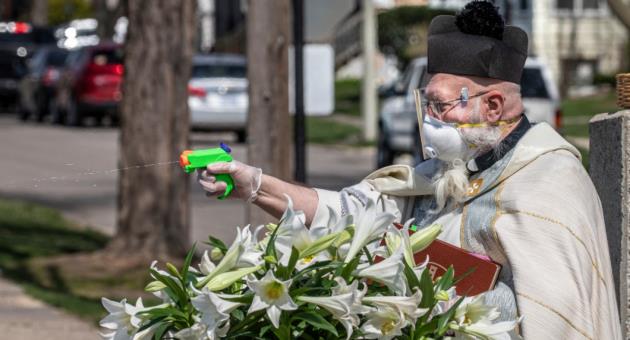 Priest uses water pistol to spray believers in fight against ...