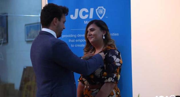 Outgoing 2020 president Markus Behmann pinning incoming 2021 president Nicole Borg