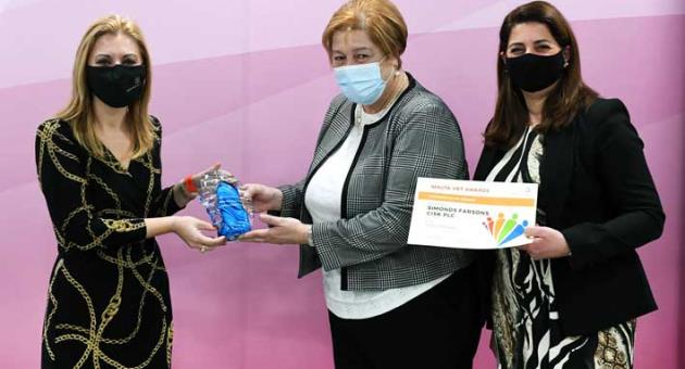Minister for Education Justyne Caruana presenting the Training at Work award to Ms Antoinette Caruana, Group HR Manager and Company Secretary, Simonds Farsons Cisk plc (centre) and Ms Mariella Galea, L & D and Performance Manager, Simonds Farsons Cisk plc.