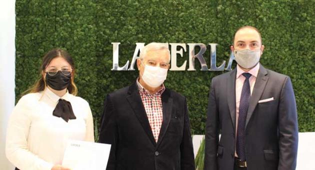 Centiane Caruana of Laferla (left) presents the donation to Victor Formosa of Id-Dar tal Providenza (centre) alongside Keith Laferla, right.