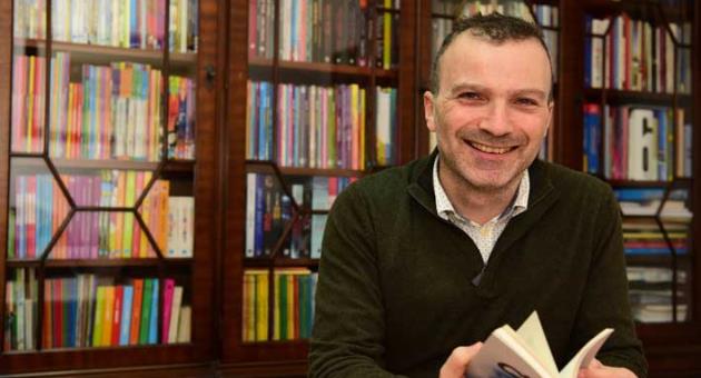 Chris Gruppetta is never far from books.  Photo by  Mark Zammit Cordina