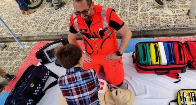 Emergency staff from Steward Malta overseeing a child performing CPR on a dummy patient during an outreach event held recently in Gharb, Gozo.