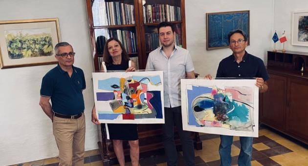 Books and paintings donation to MSA - From left Joe Scerri MSA Manager, Caroline Miggiani MSA Hon. Secretary, Roderick Camilleri MSA Vice President, Profs. Joseph P. Cassar 