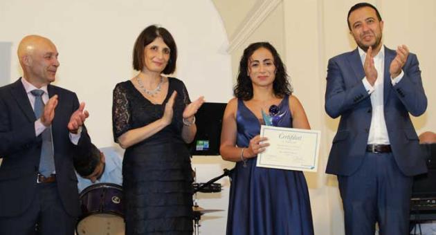Charmaine Cini receiving the Worker of the Year award.