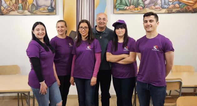 FinanceMalta team members with Fr Marcellino Micallef OFM