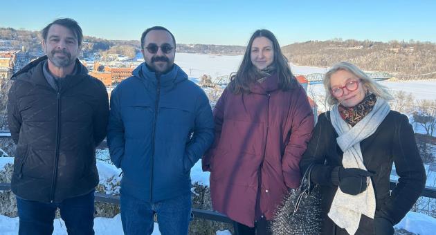 The team from left: Christophe Bourdinaud, Serhat Gur, Ada Gur, and Amelie Saint George taking in the views overlooking historic Stillwater, Minnesota.