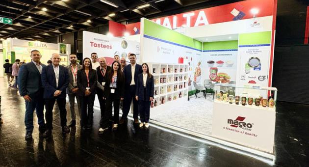Ms Richard Scerri, Head of Trade Promotion together with some of the Maltese exhibitors in front of the Malta Pavilion at Anuga 2025, Cologne, Germany.