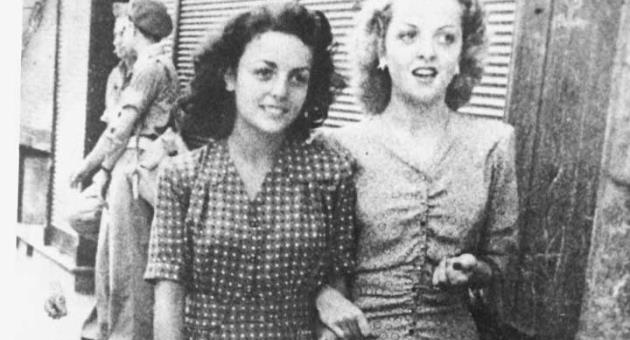 Anna and Angela Mastronuzzi strolling in Taranto in 1946, note the British men in military uniform in the background.  
